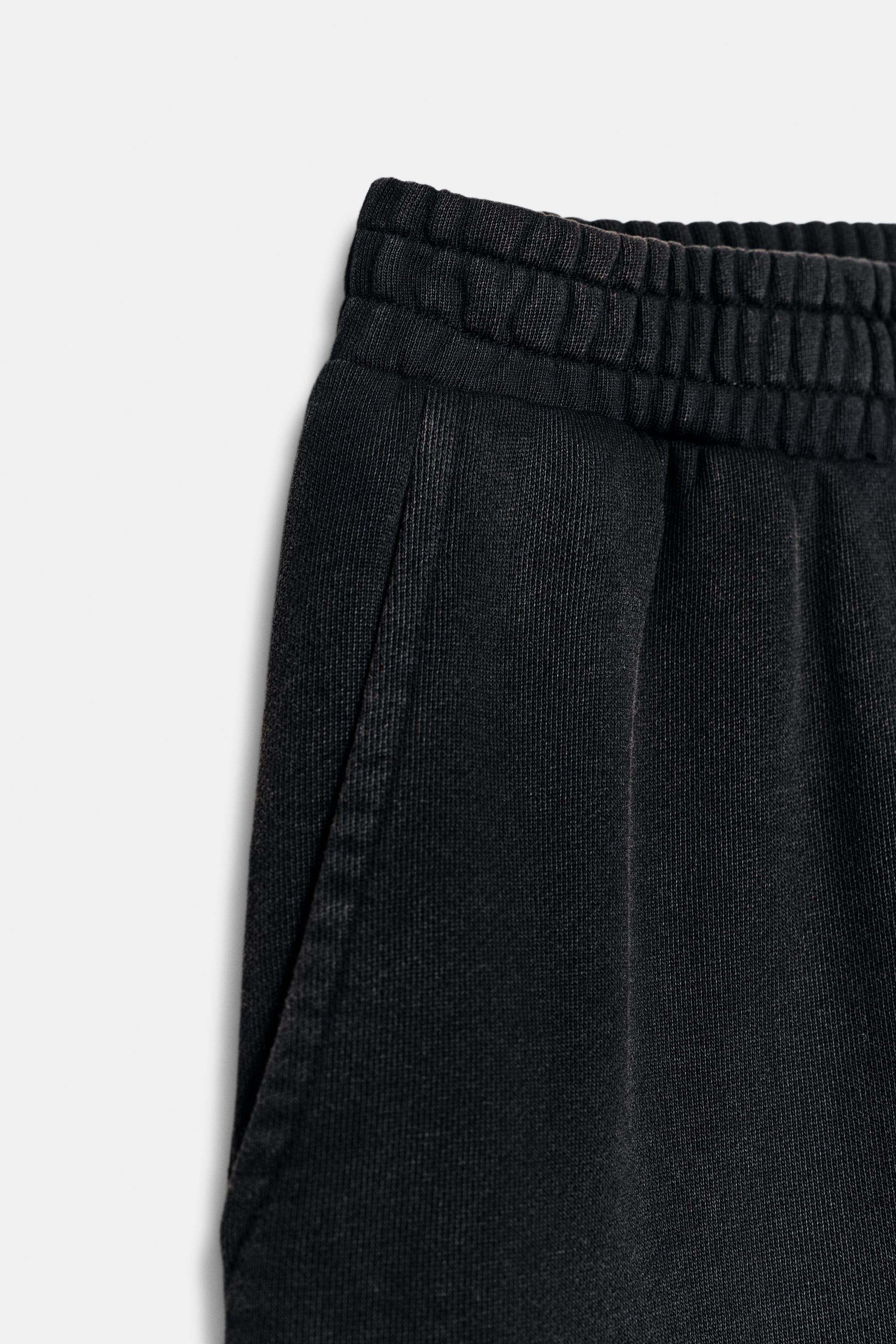 WASHED EFFECT FLEECE PANTS WITH STUDS